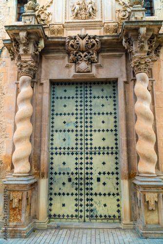 Beautiful old door in the entrance of a convent in Almansa, Albacete (Spain) photo
