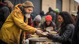 A person smiles while volunteering, handing out food to a diverse community at an outdoor charity event.