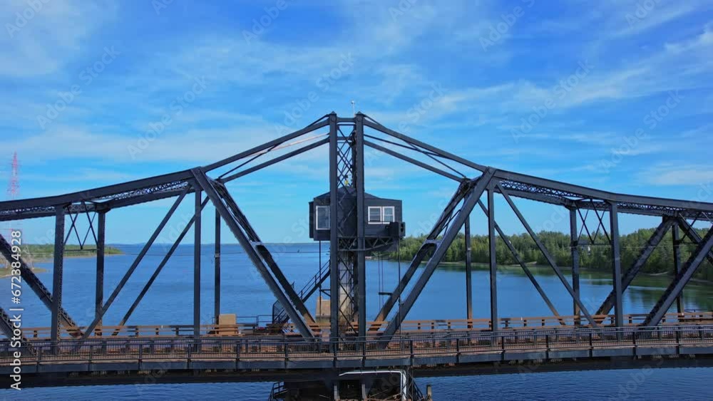 Very old swing bridge located at Little Current town in Ontario Canada. It connects Manitoulin Island to Goat island and mainland over the North Channel. Use for boat pass and has only one car lane. Very old swing bridge located at Little Current town in Ontario Canada. It connects Manitoulin Island to Goat island and mainland over the North Channel. Use for boat pass and has only one car lane.