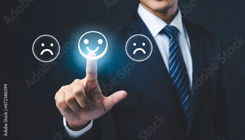 Finger of businessman touching and check mark icon face emoticon smile on dark background, service mind, service rating. Satisfaction and customer service concept