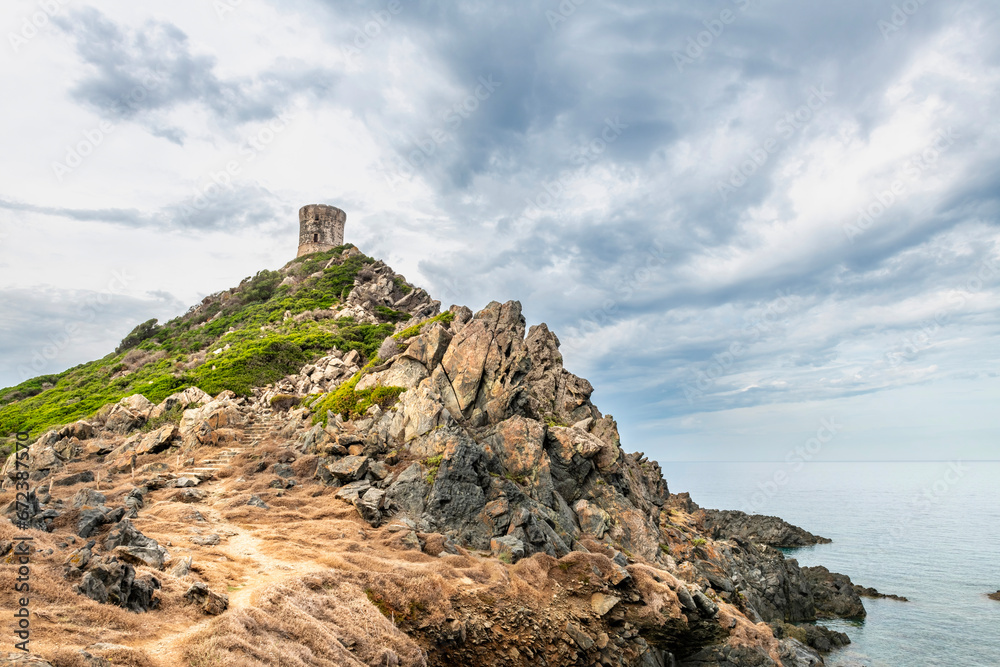 Rocky Coastline. Sanguinaire islands and Parata Tower in Corsica. Near Ajaccio in the Mediterranean Sea, Torra Ghjinuvesa di a Parata, Corsica, France Rocky Coastline. Sanguinaire islands and Parata Tower in Corsica. Near Ajaccio in the Mediterranean Sea, Torra Ghjinuvesa di a Parata, Corsica, France