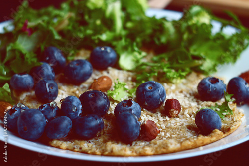 Oatmeal pancake with blueberries. Healthy breakfast.