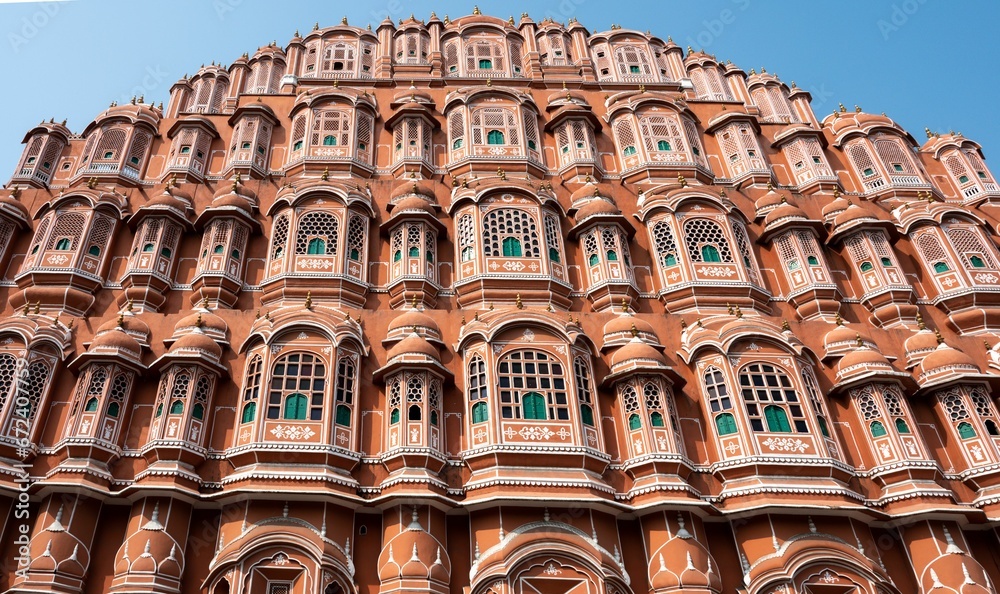 Low-angle shot of the iconic Hawa Mahal in Jaipur, India, featuring detailed architectural elements