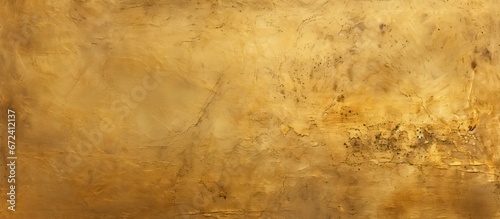 Background of a texture with an aged and gold colored cement wall