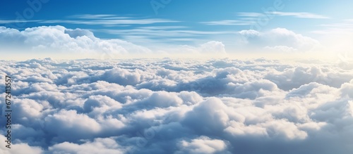 Beautiful view above the clouds with bright blue Sky and white clouds.as a nature concept. Sunny weather for summer.