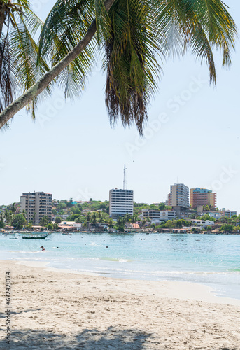 Beach photos, person's point of view, palm trees, umbrellas. Pampatar Beach, Margarita Nueva Esparta © manuel