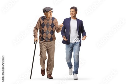 Elderly man with a cane walking and talking to a young man