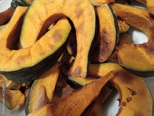 sliced pumpkin on wooden table