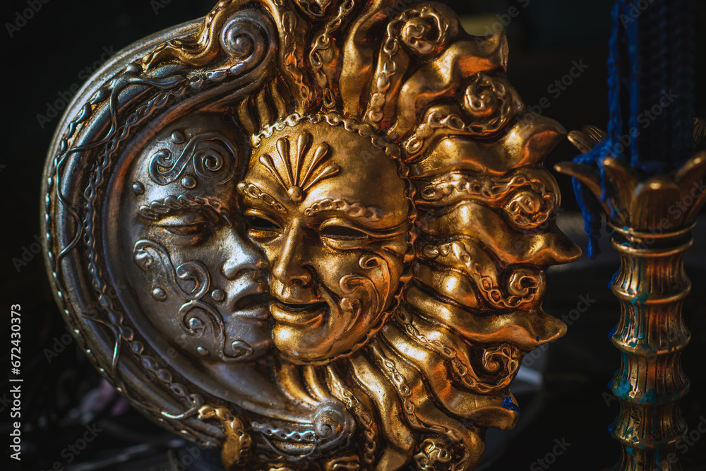 Mystical concept. Venice magical detail. Masks with sun and moon. Handmade decoration