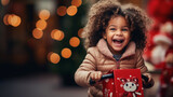 A preschooler with curly hair, clapping with joy at the sight of a new bike with a big red bow, joyful child looking for gifts under the tree, blurred background, with copy space