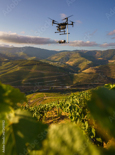Drone footage of drone with bottle of wine above vineyards on the banks of the Duoro in Portugal's Duoro Valley
