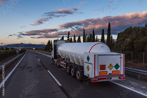 Tanker truck transporting refrigerated liquid oxygen, with ADR label for oxidizing product and not flammable or toxic. photo