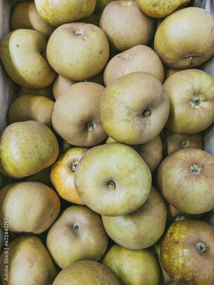 Close up of reinette grise du canada apples in wooden crates. Prepared for sale. Wooden box Close up of reinette grise du canada apples in wooden crates. Prepared for sale. Wooden box