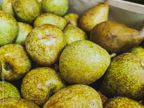 Close up of General Leclerc pears in wooden crates. Prepared for sale. photo