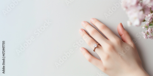 illustration of a woman's hand with a wedding ring on a light background. Created with Generative AI
