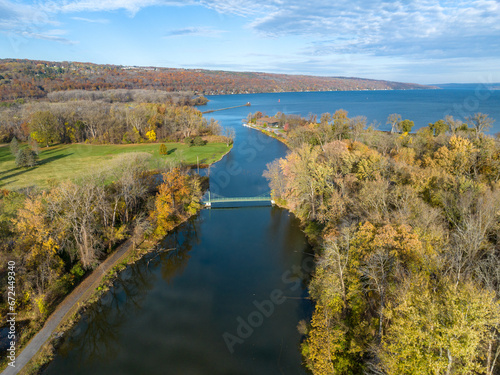 Fall, autumn, drone aerial image with view of Stewart Park at the south end of Cayuga Lake, Ithaca New York. 