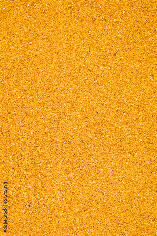 Fototapeta premium turmeric powder textured background, close up