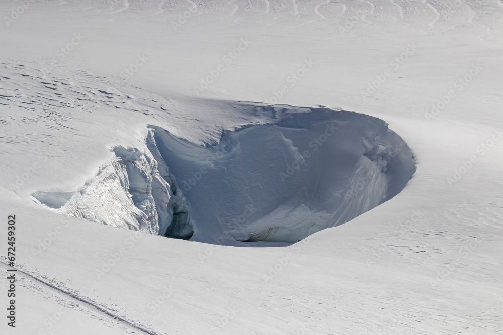 Snow covered landscape with hole during winter day Snow covered landscape with hole during winter day