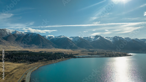 The untouched beauty of Lake Ohau surrounded by the snow capped southern alps mountain range