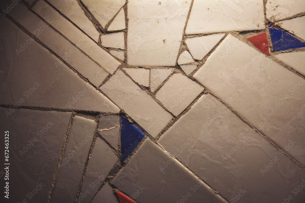 Detail of beautiful old collapsing abstract ceramic mosaic adorned building. Venetian mosaic as decorative background. Selective focus. Abstract Pattern. Abstract mosaic colored ceramic stones.