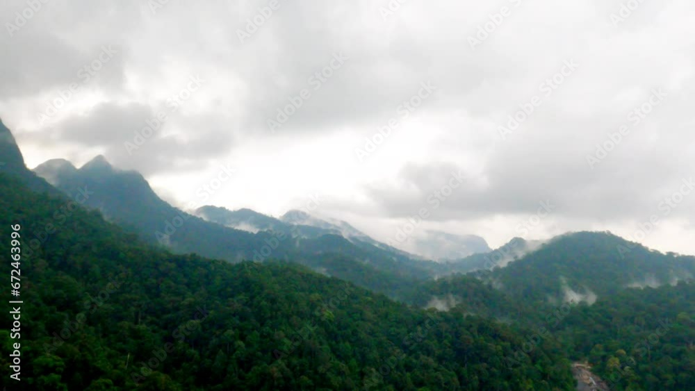Drone view of lush green mountains in rainy weather Drone view of lush green mountains in rainy weather