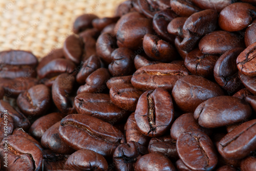 Freshly baked dried coffee beans on background Freshly baked dried coffee beans on background