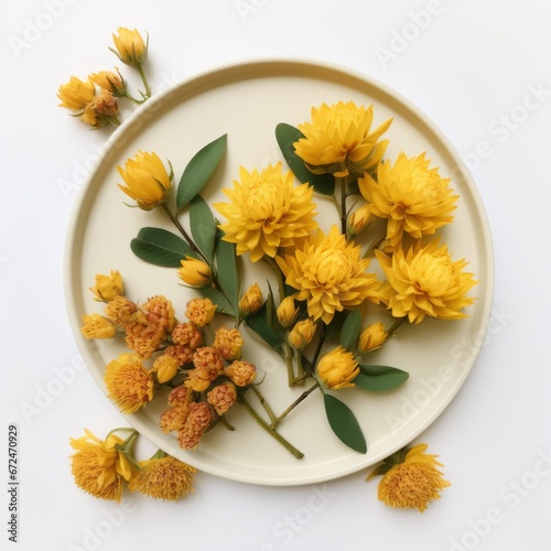 a plate with yellow flowers