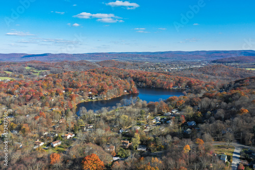 Wantage NJ and Lake Neepaulin on a sunny autumn day with fall foliage aerial 