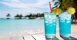 A Refreshing Blue Cocktail Awaits on a Crisp White Table, Set Against the Mesmerizing Dance of Sunlight on Ocean Waves. Generative AI