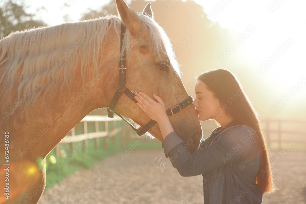Beautiful woman with adorable horse outdoors on sunny day. Lovely domesticated pet Beautiful woman with adorable horse outdoors on sunny day. Lovely domesticated pet