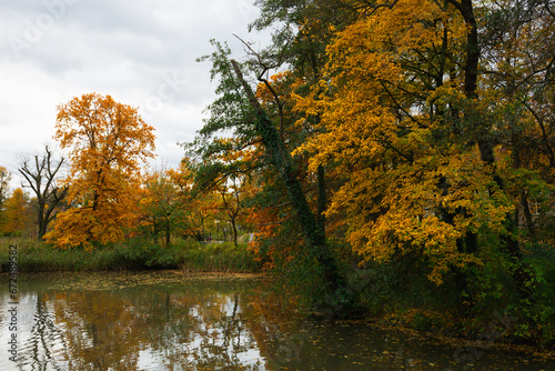 Autumn Solacz Park with Yellow Trees, Leaves and Pond. Poland, Poznan