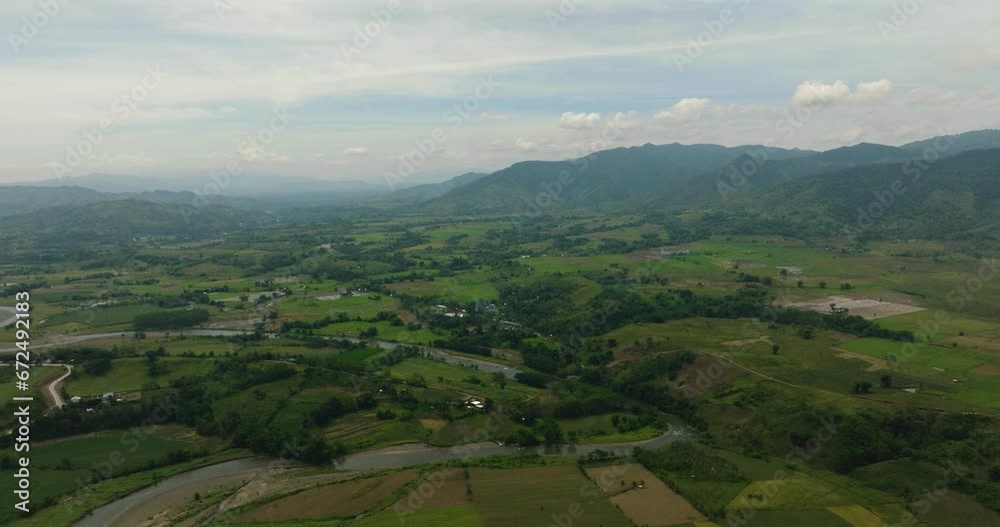 Mountain with hills and green forest. Farmlands and water flowing on river. Mindanao, Philippines. Mountain with hills and green forest. Farmlands and water flowing on river. Mindanao, Philippines.