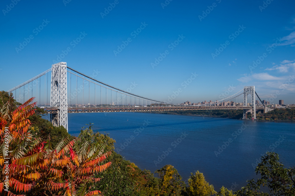 A distance view of George Washington Bridge in the Fort Lee Historic park in Autumn A distance view of George Washington Bridge in the Fort Lee Historic park in Autumn