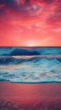 red sky at sunset with a beach with waves