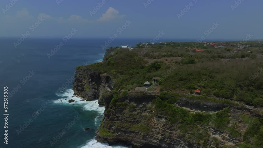 Cliff aerial top down view of a rocky coastline in Uluwatu, Bali. Cliff aerial top down view of a rocky coastline in Uluwatu, Bali.