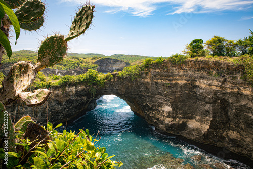 The spectacular phenomenon of a natural bridge between the bay and the ocean at Broken beach on the island of Nusa Penida near Bali  Indonesia