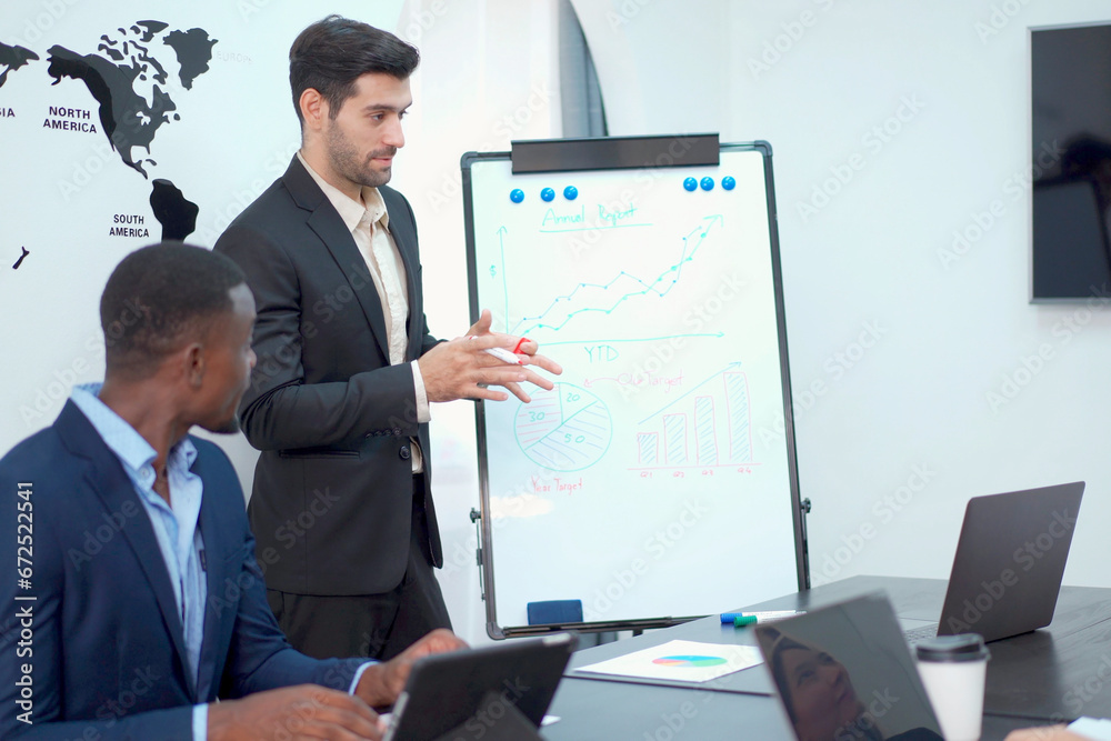 Businesspeople in meeting room discussing business plan. Businesspeople in meeting room discussing business plan.