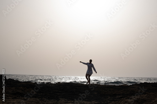 silhouette of a person on the beach