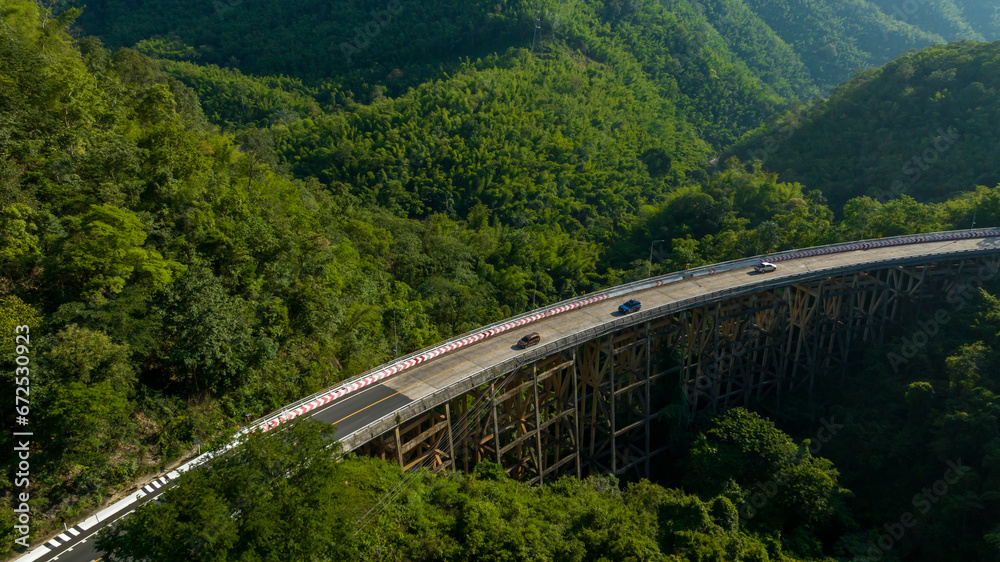 Aerial view of bridge, car, mountain forest, Landscape with beautiful road, Bridge and the road over the mountain.
