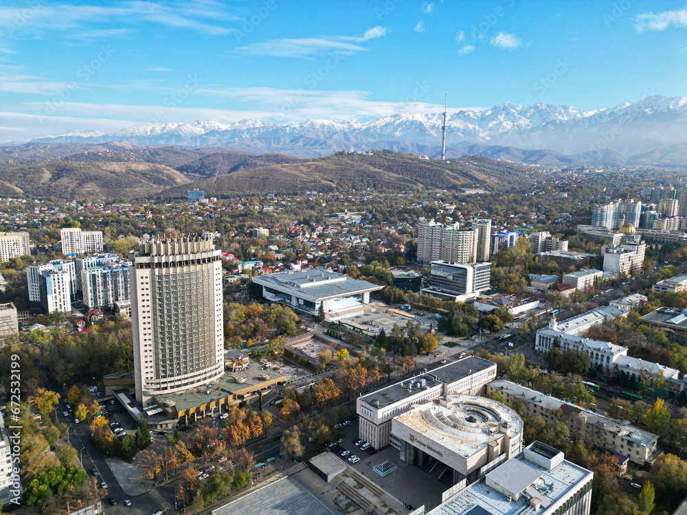 Fototapeta premium Hotel Kazakhstan with a view of various residential and commercial buildings and the central streets of the city.