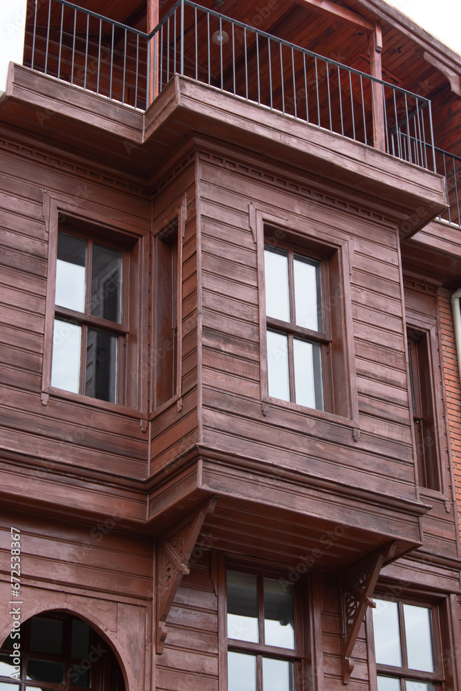 restored wooden house with grilled windows and balcony restored wooden house with grilled windows and balcony
