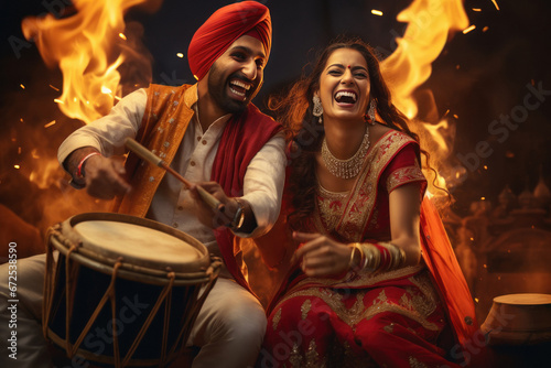 Young indian punjabi couple dancing on traditional festival. photo