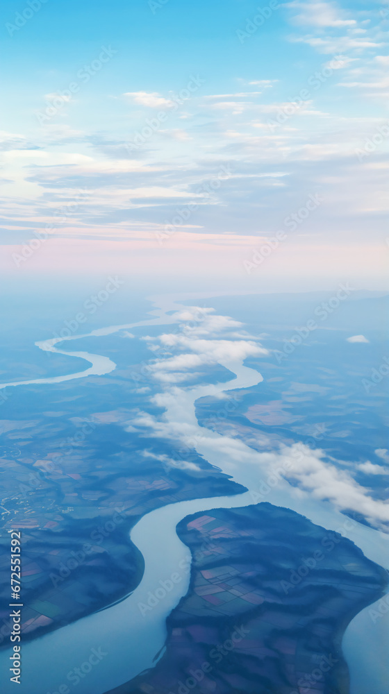 a view of a river and a city from an airplane a view of a river and a city from an airplane