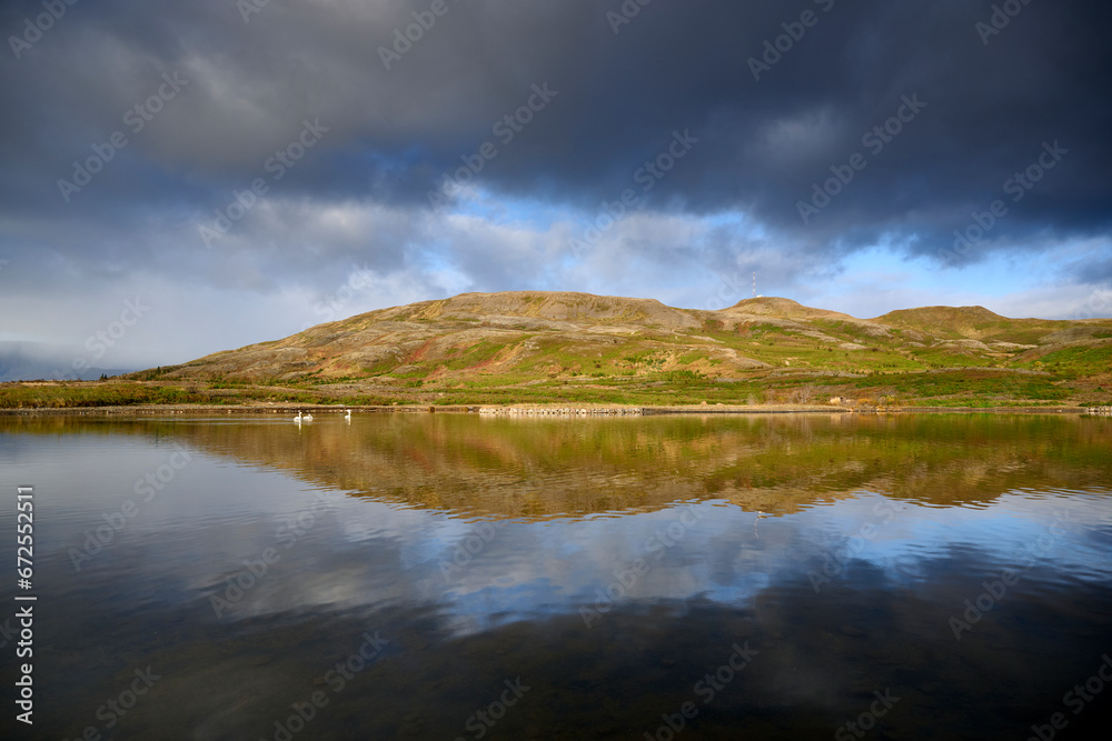 Scenic view of calm lake against hills