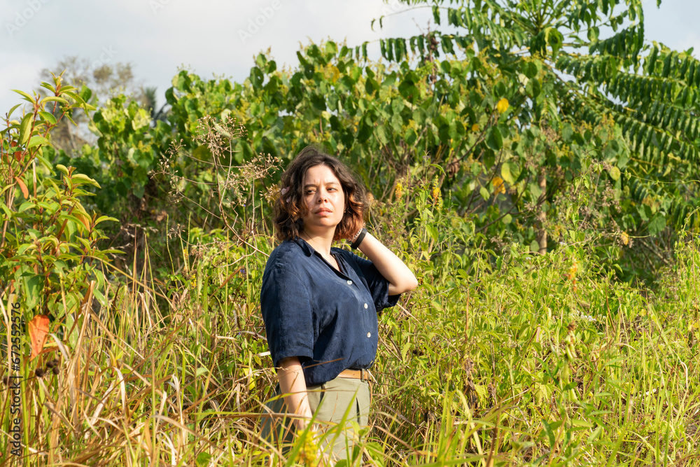 Woman on trip, walking and hiking through terraces in Bali Woman on trip, walking and hiking through terraces in Bali