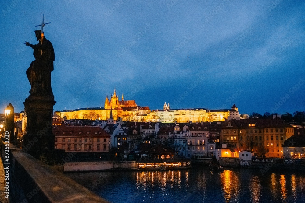 Winter twilight in Prague, snow, no one, lights on, Charles Bridge