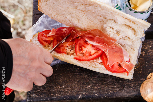 woman making a tuna sandwich photo