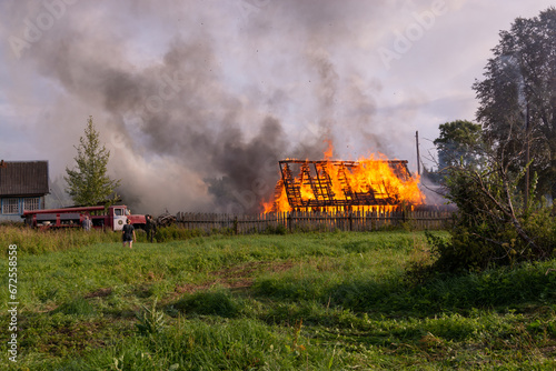 A fire in the village. Burning wooden houses in the village of Rantsevo, Tver region. photo