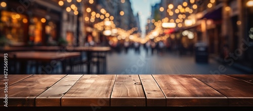 Product display montage with a blurry restaurant or coffee shop background and an empty wooden table platform