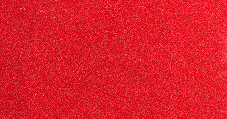Red paper glitter texture christmas background.